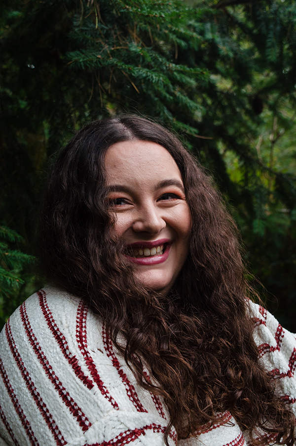 An image of Kathryn smiling in the wilderness